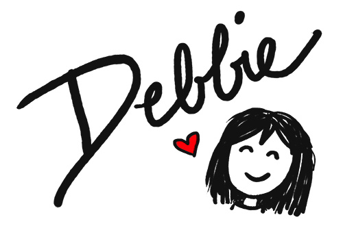 Handwritten text shows Debbie's signature and a small hand-drawing cartoon smiling face.