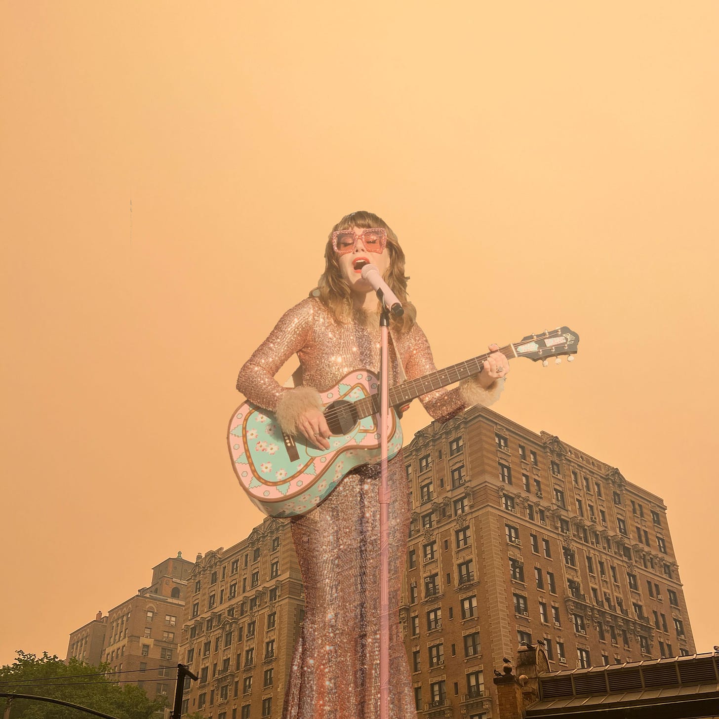 Jenny Lewis performing superimposed on a photo of orange, smoke-filled air in New York City