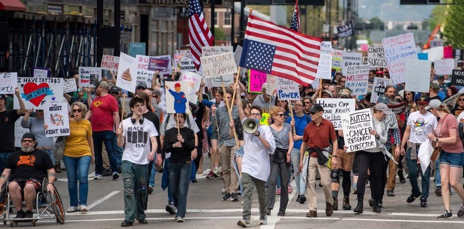 Demonstrators participate in the 50501 Day of Protest in Cincinnati, Ohio, on April 19, 2025.