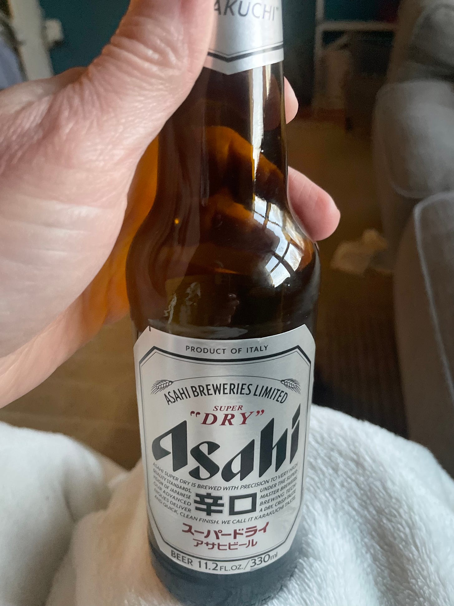 Close-up shot of Asahi Super Dry beer bottle.
