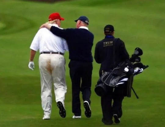 Trump walking on golf course with large, brown stain in the crack of his pants clearly visible