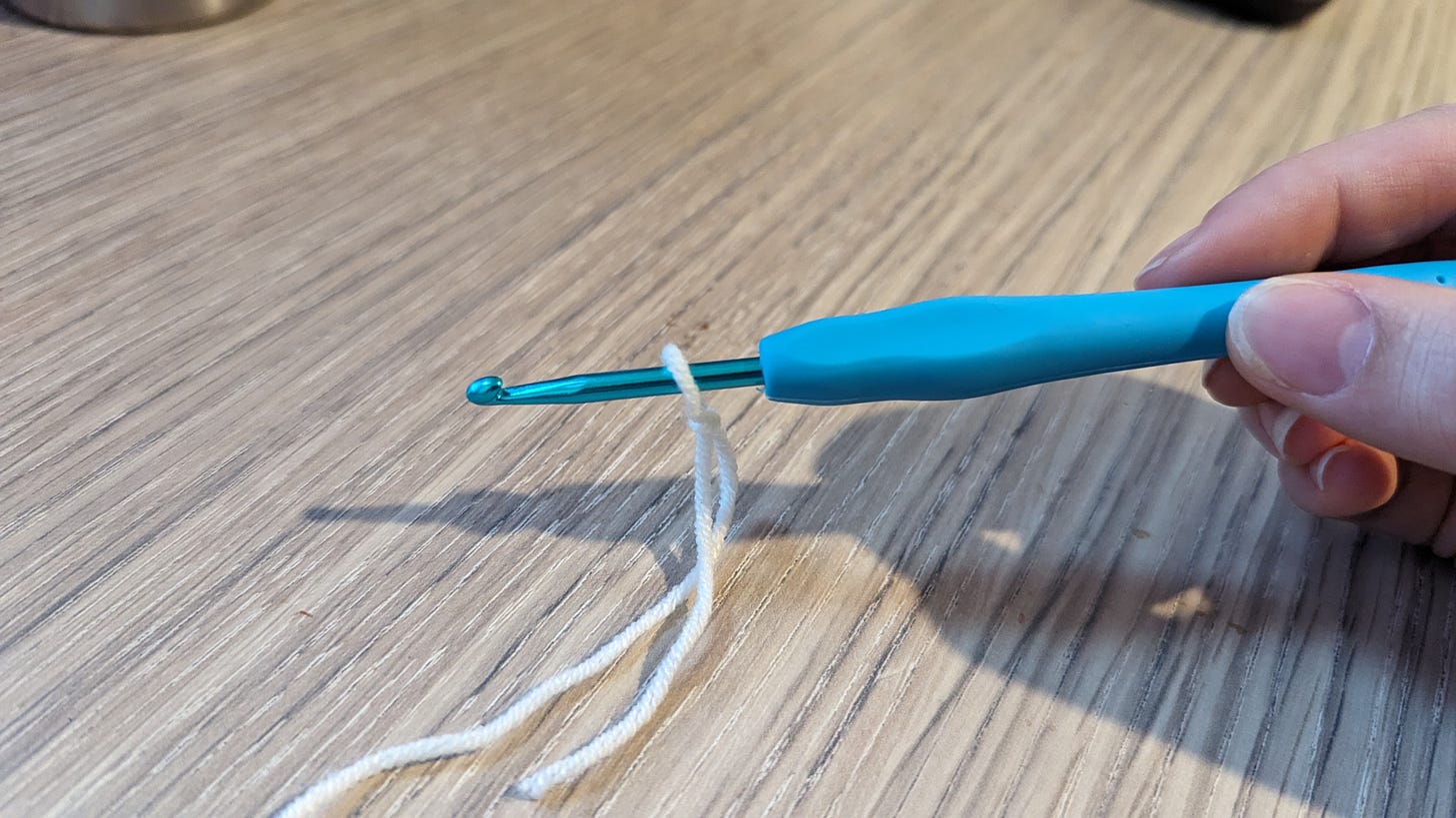 A slip knot over a crochet hook