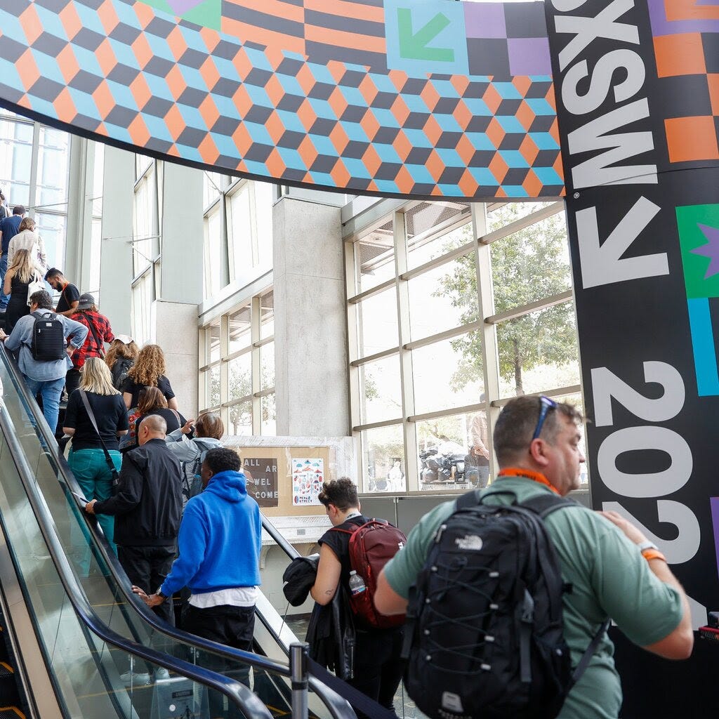 Attendees on escalators at SXSW at the Austin Convention Center.