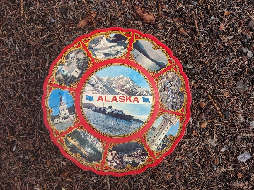 a retro alaskan tourism plate