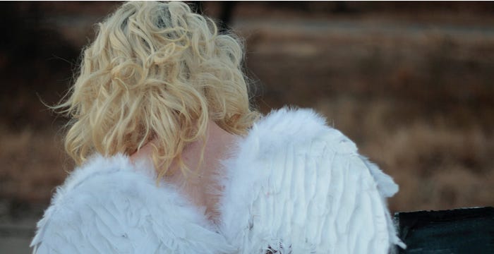 Woman wearing angel wings