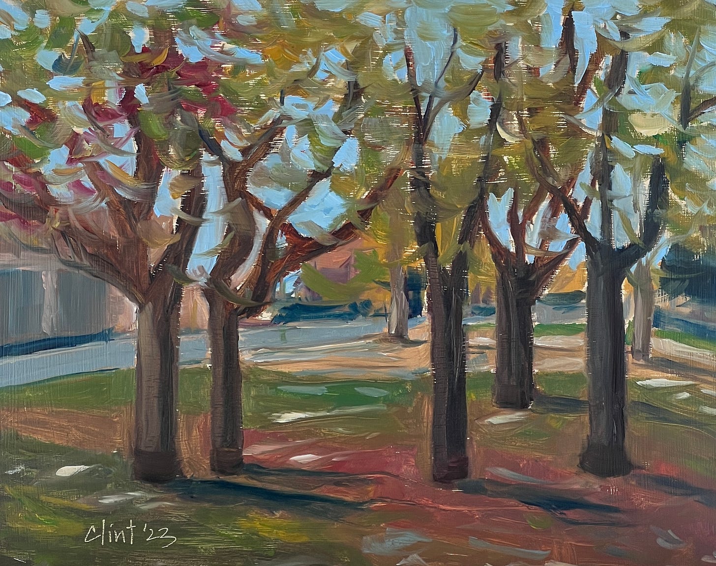 An oil painting showing five trees with autumn foliage in a park with light casting shadows on the ground.