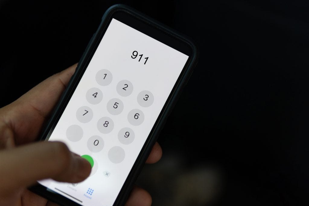 A person dials 911 on a mobile phone. (Getty Images)
