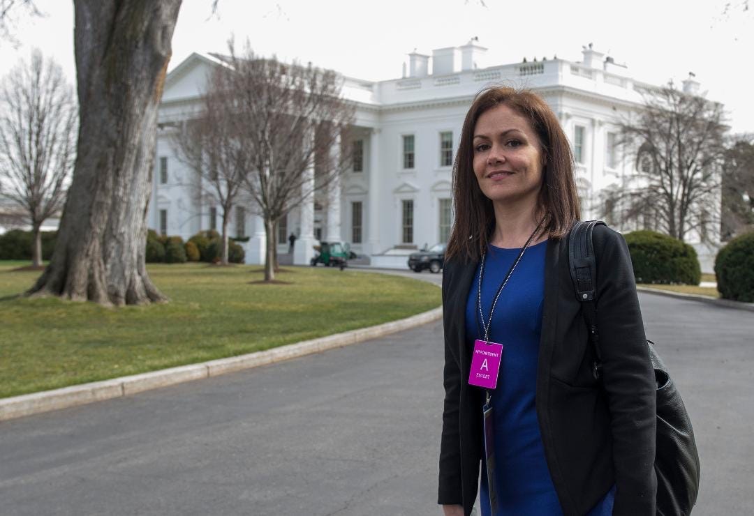 Emily Nash standing outside the White House