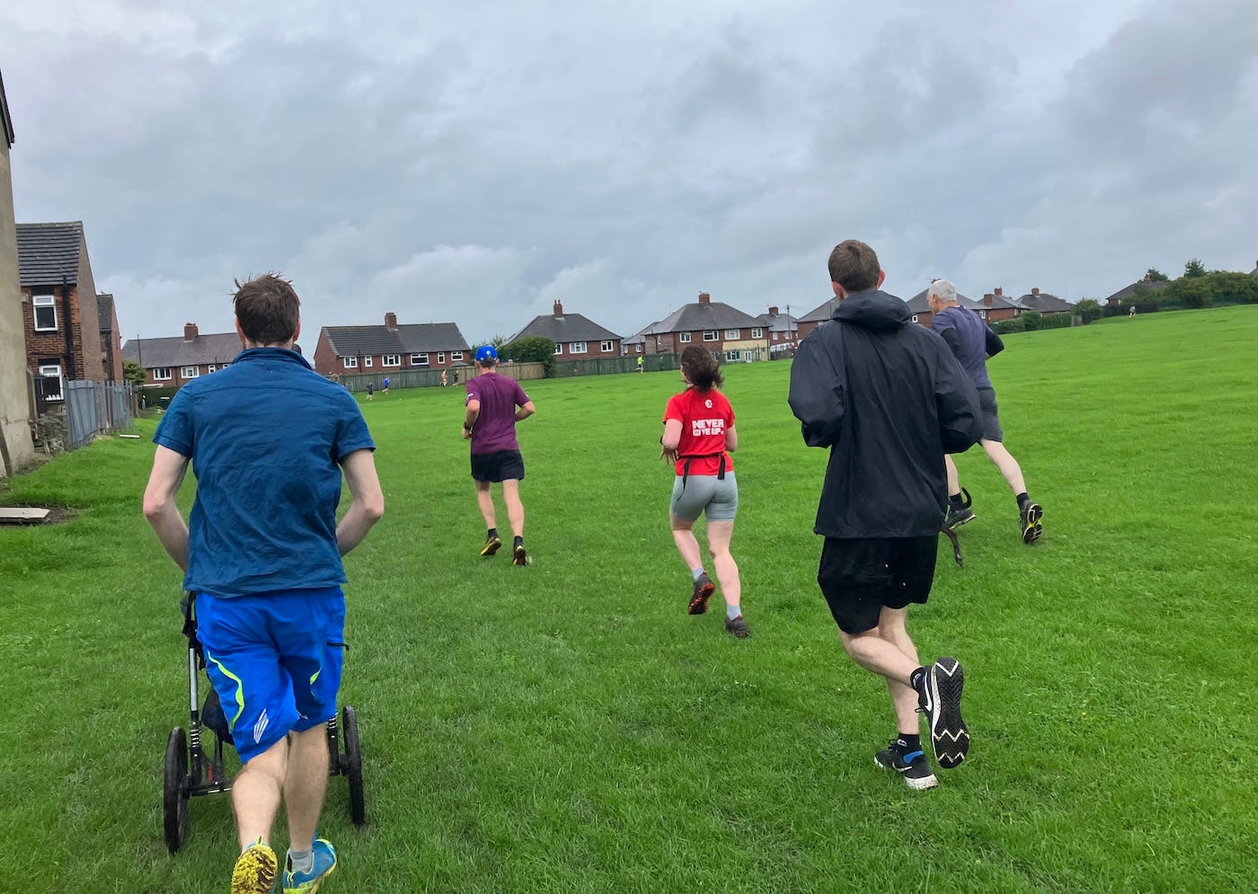 Runners in a grassy field