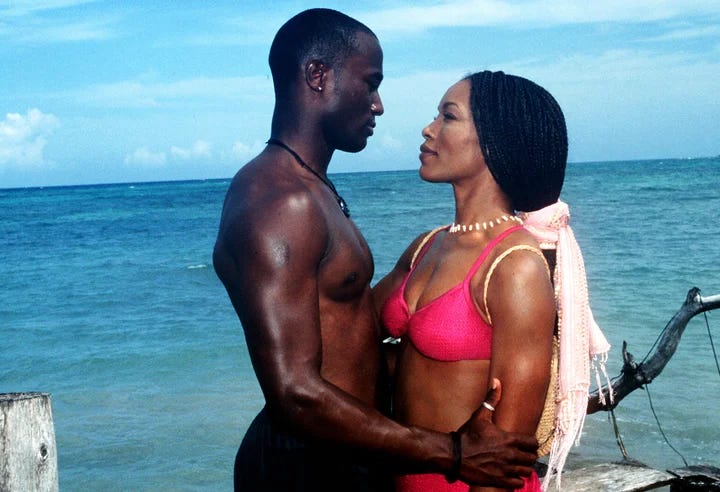 Taye Diggs and Angela Bassett on the beach in How Stella Got Her Groove Back.