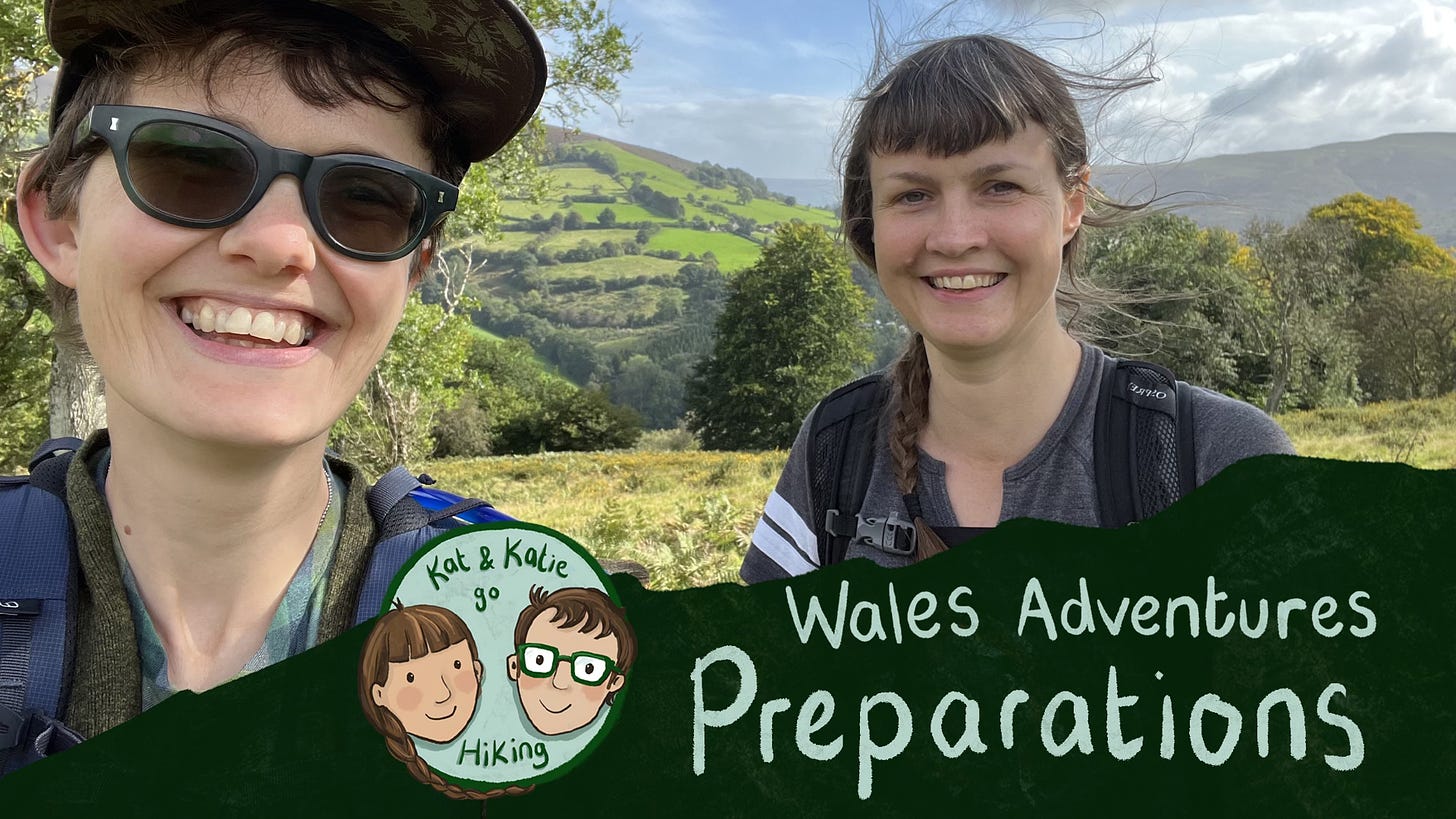 Title card for a video. Two friends smiling in front of green rolling hills. Text says 'Wales Adventures: Preparations"