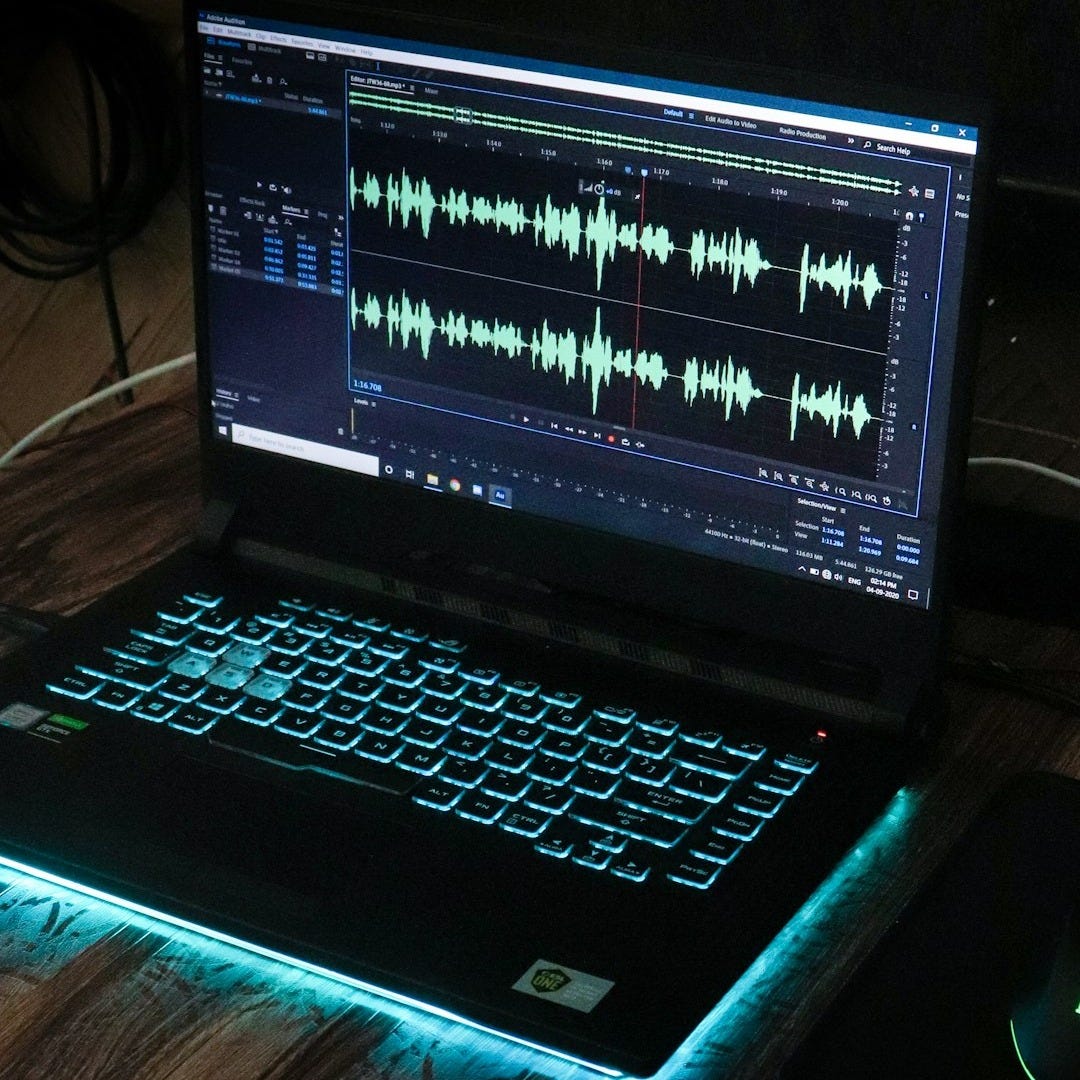 black laptop computer on brown wooden table