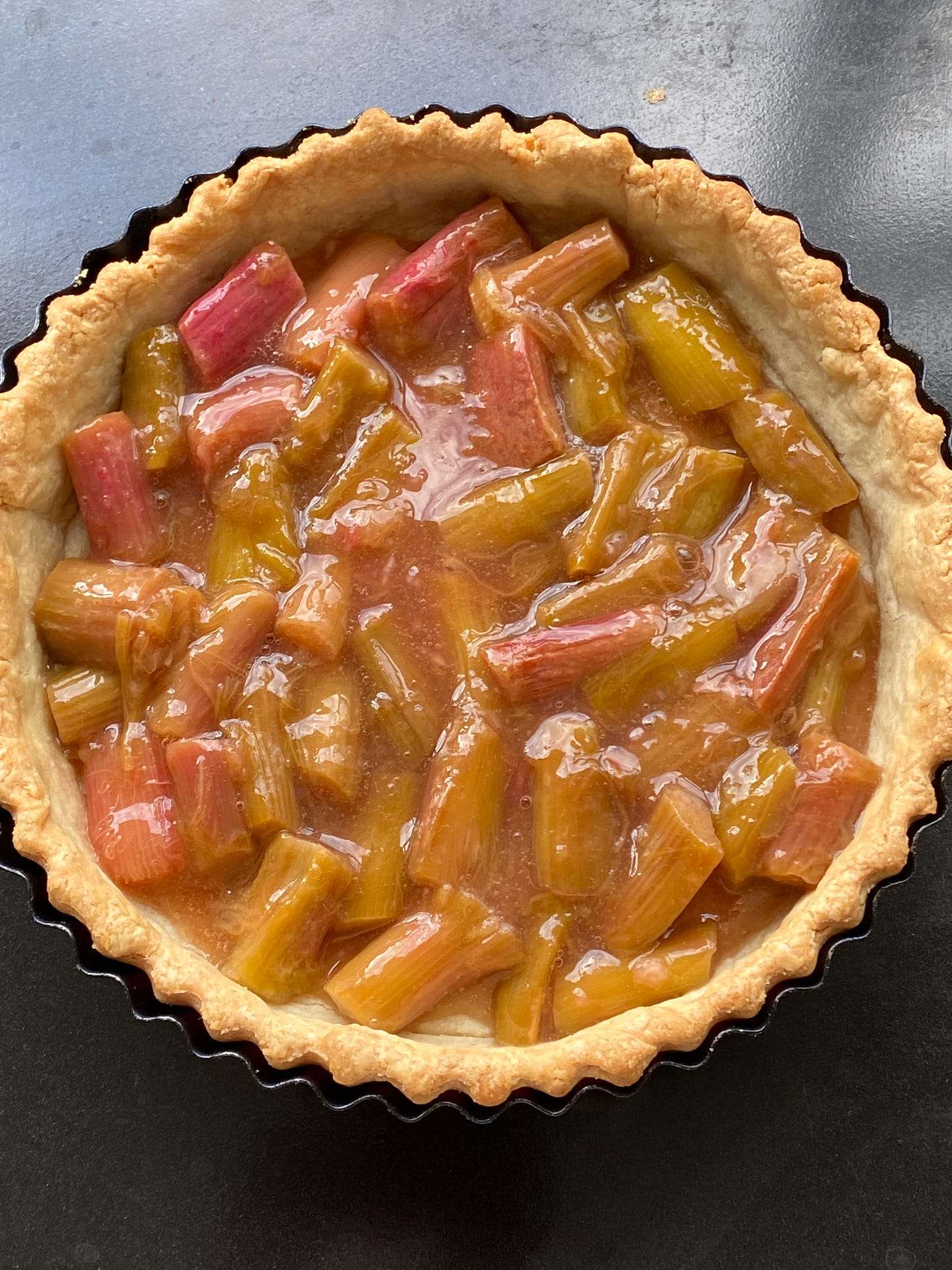 Rhubard and Apple Tart on a counter top.