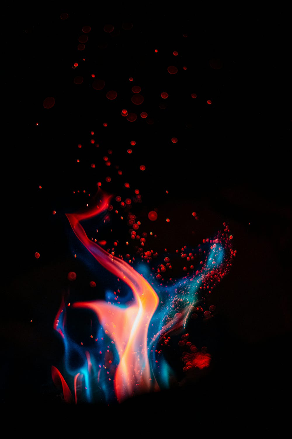 A fire burning brightly in several colors.