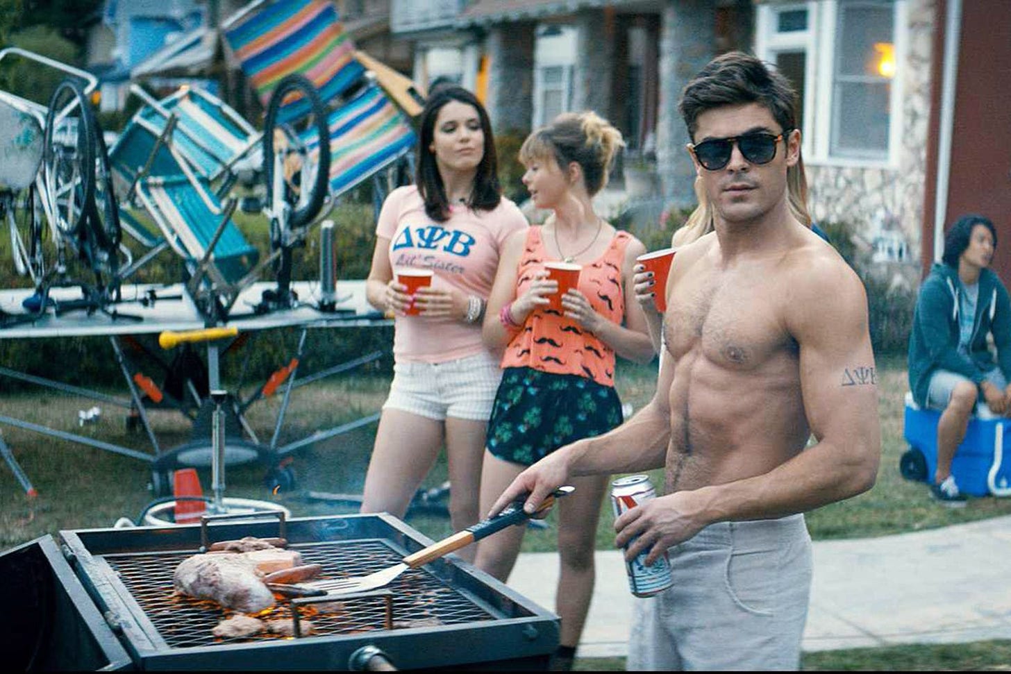 Zac Efron topless barbecuing in the frathouse movie Neighbors 