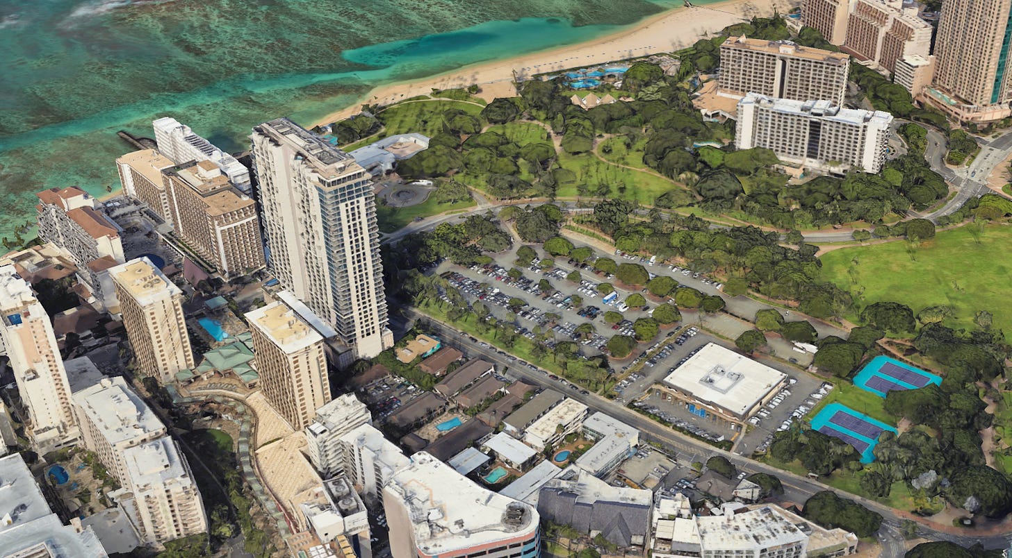 An image of Waikiki with a large one-story USPS building