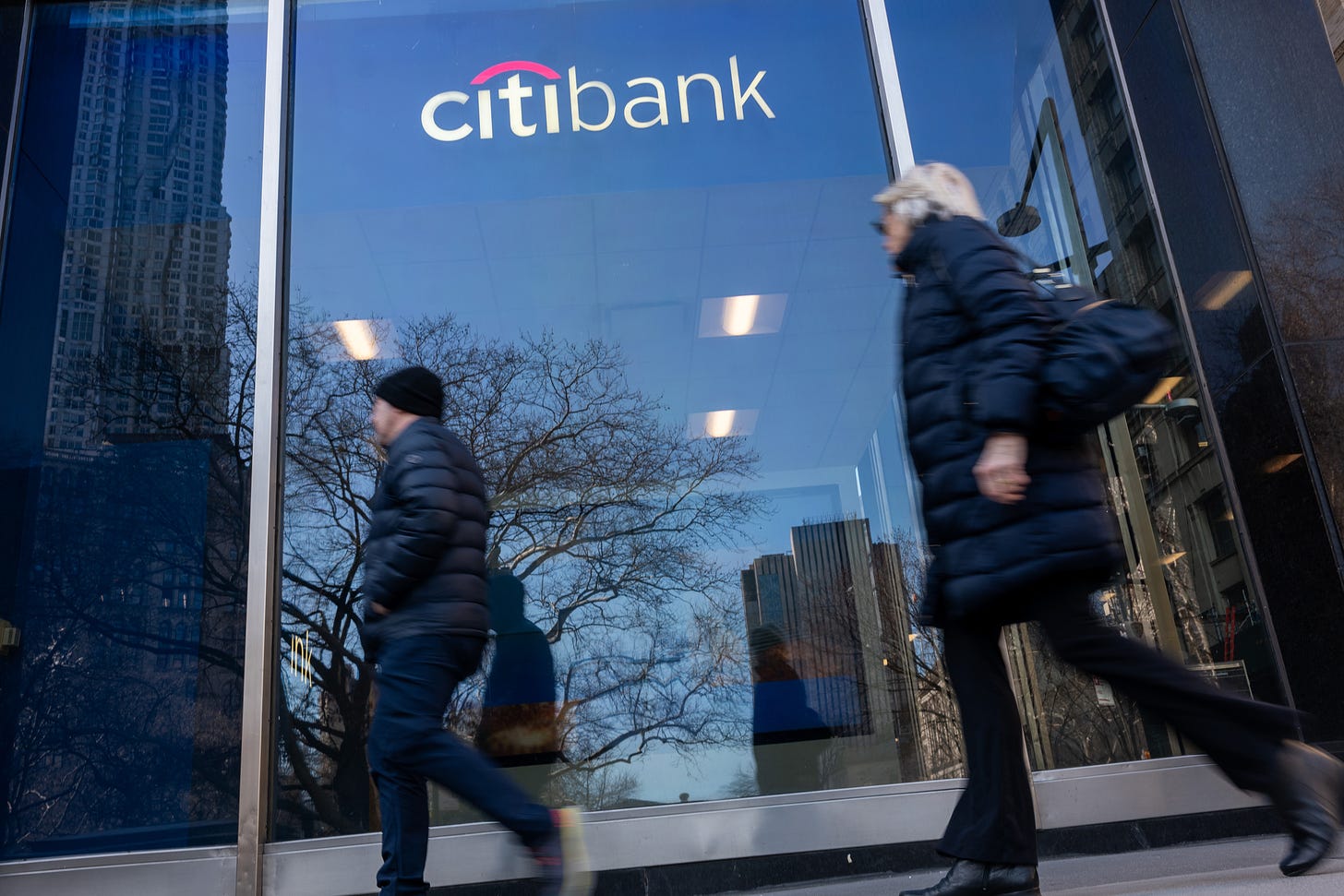 People walk by a CitiBank location in New York City on March 1. Credit: Spencer Platt/Getty Images