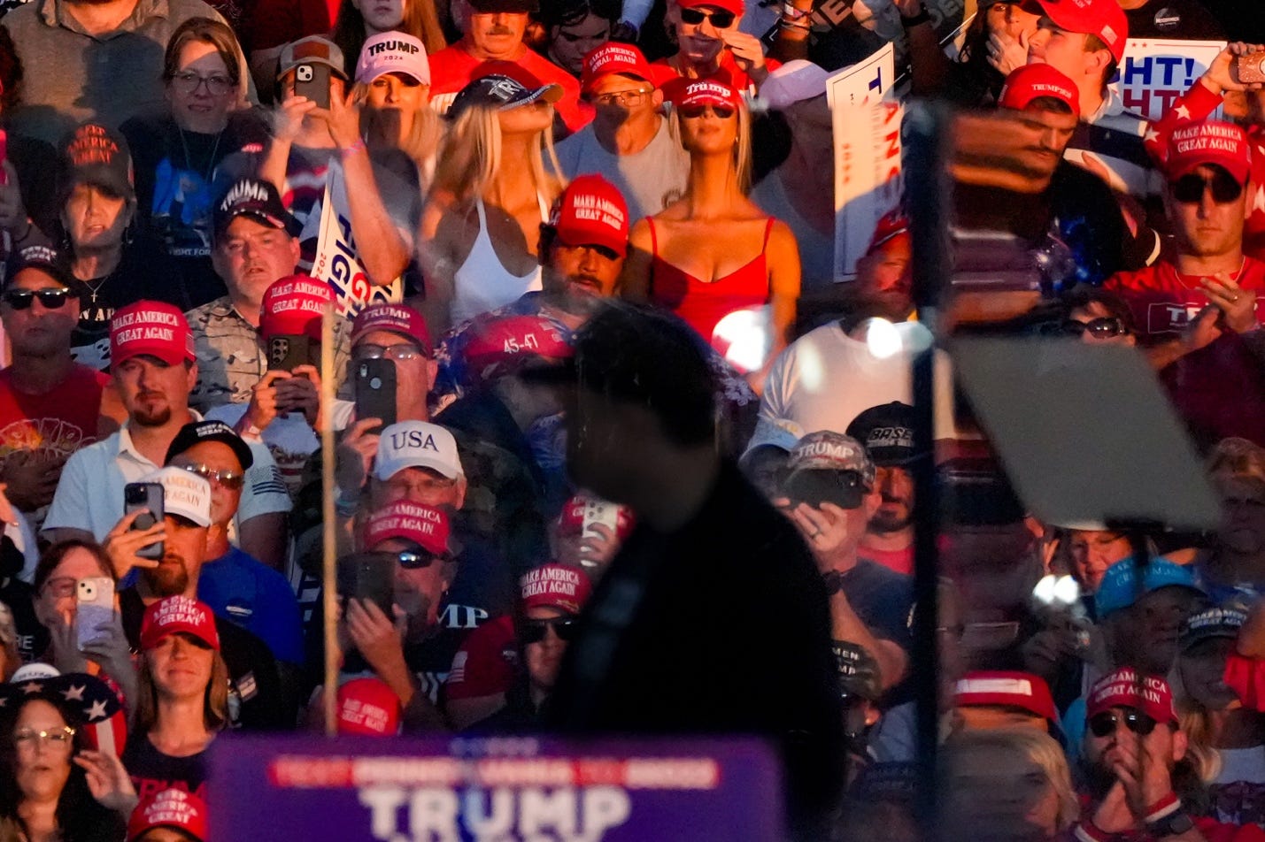 Elon Musk looks back at Trump supporters during a rally in Butler, Pennsylvania, October 5, 2024. This was Musk's first appearance at a Trump rally after becoming a dedicated supporter of the former President during the election cycle. He has been enthusiastically embraced by the MAGA community.