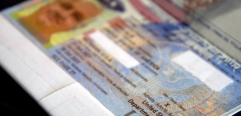 Close-up of a passport

Description automatically generated