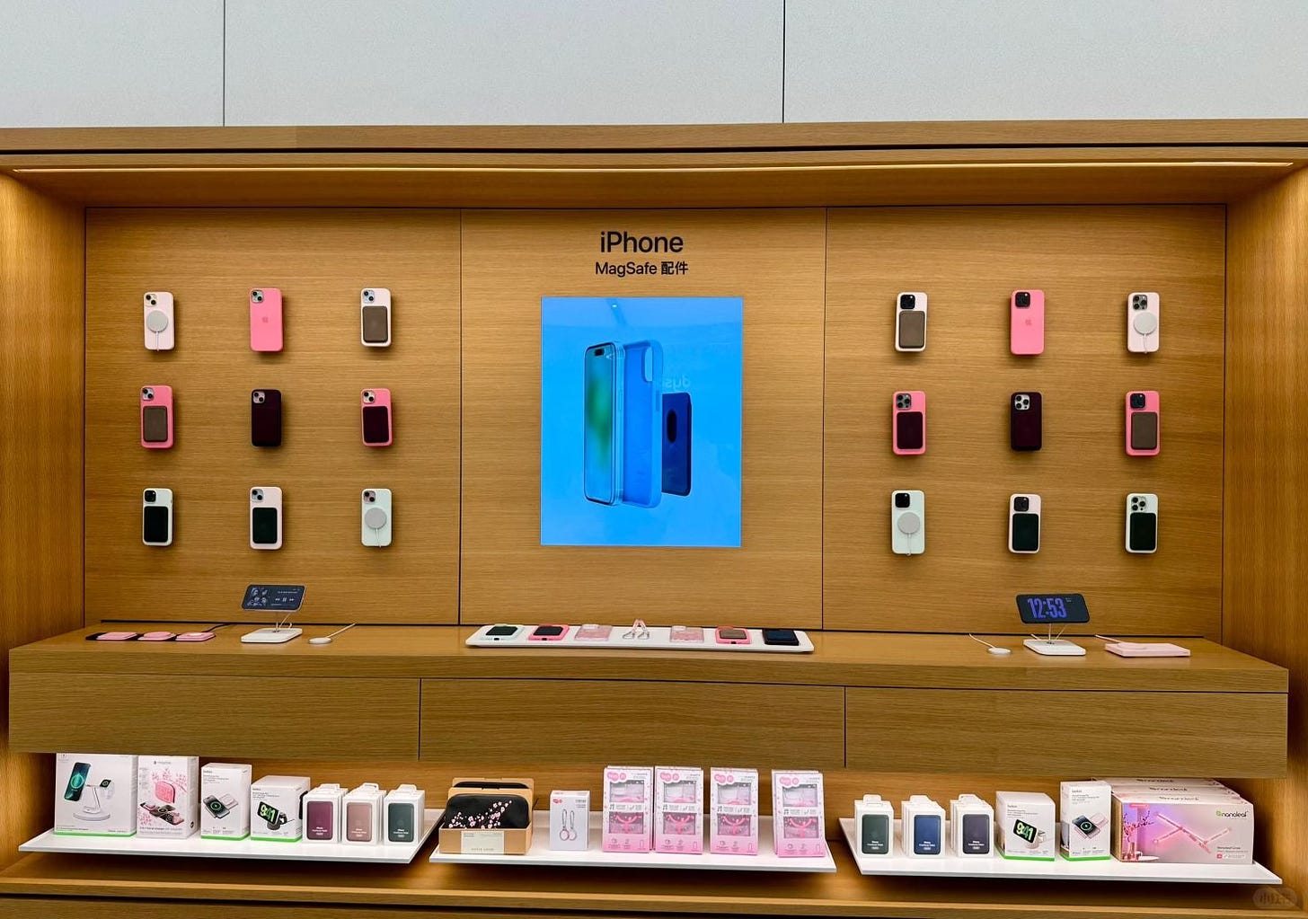 An iPhone MagSafe accessory bay merchandised with pink cherry blossom accessories.