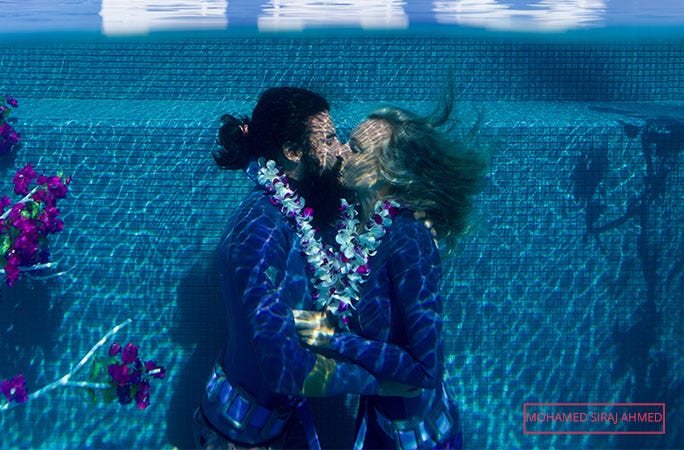 beth and miles kiss underwater