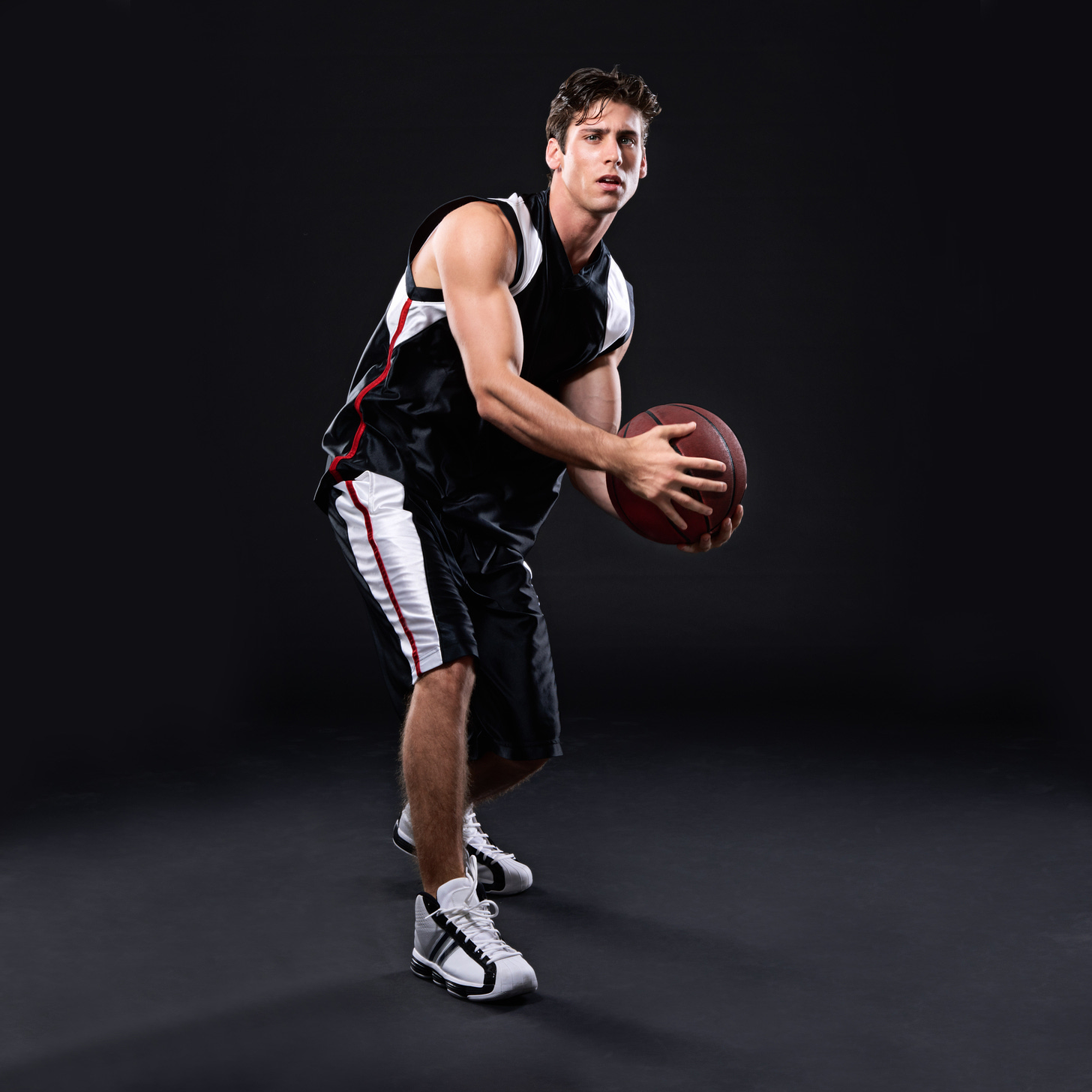 A picture of a male basketball player of unknown gender identity but he could, like, be a diversely-bodied woman