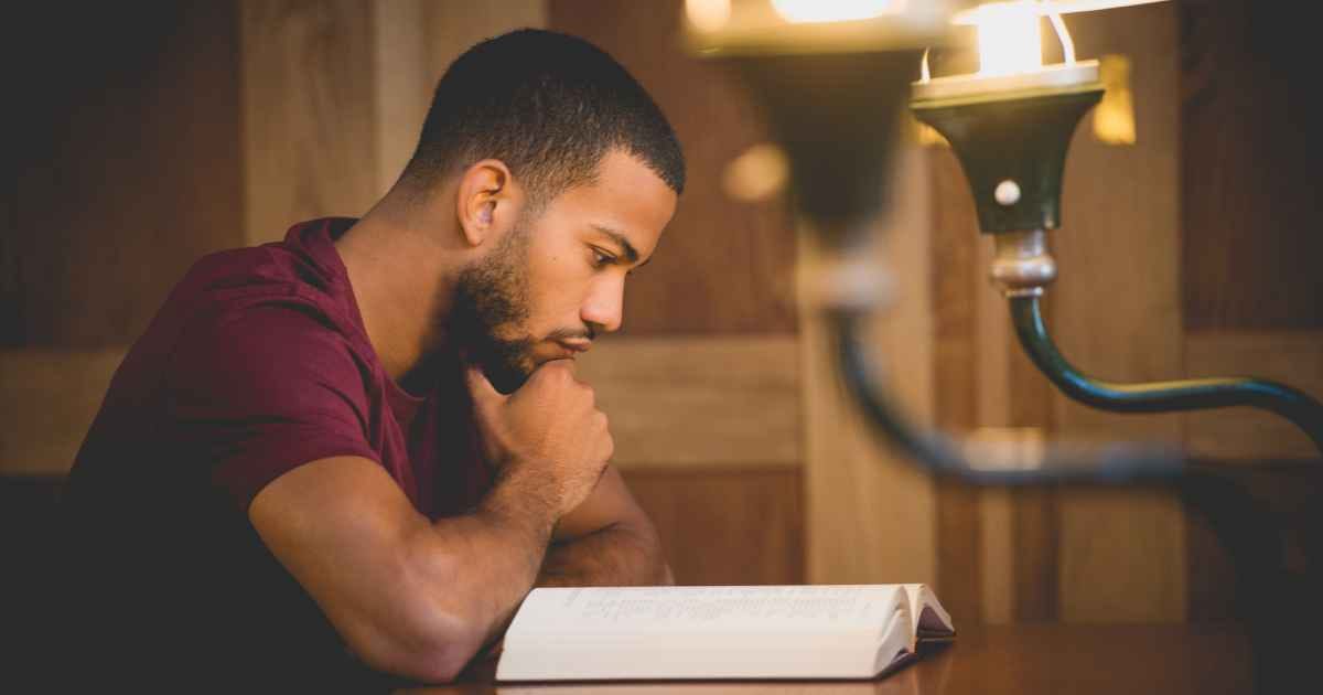 young man reading book