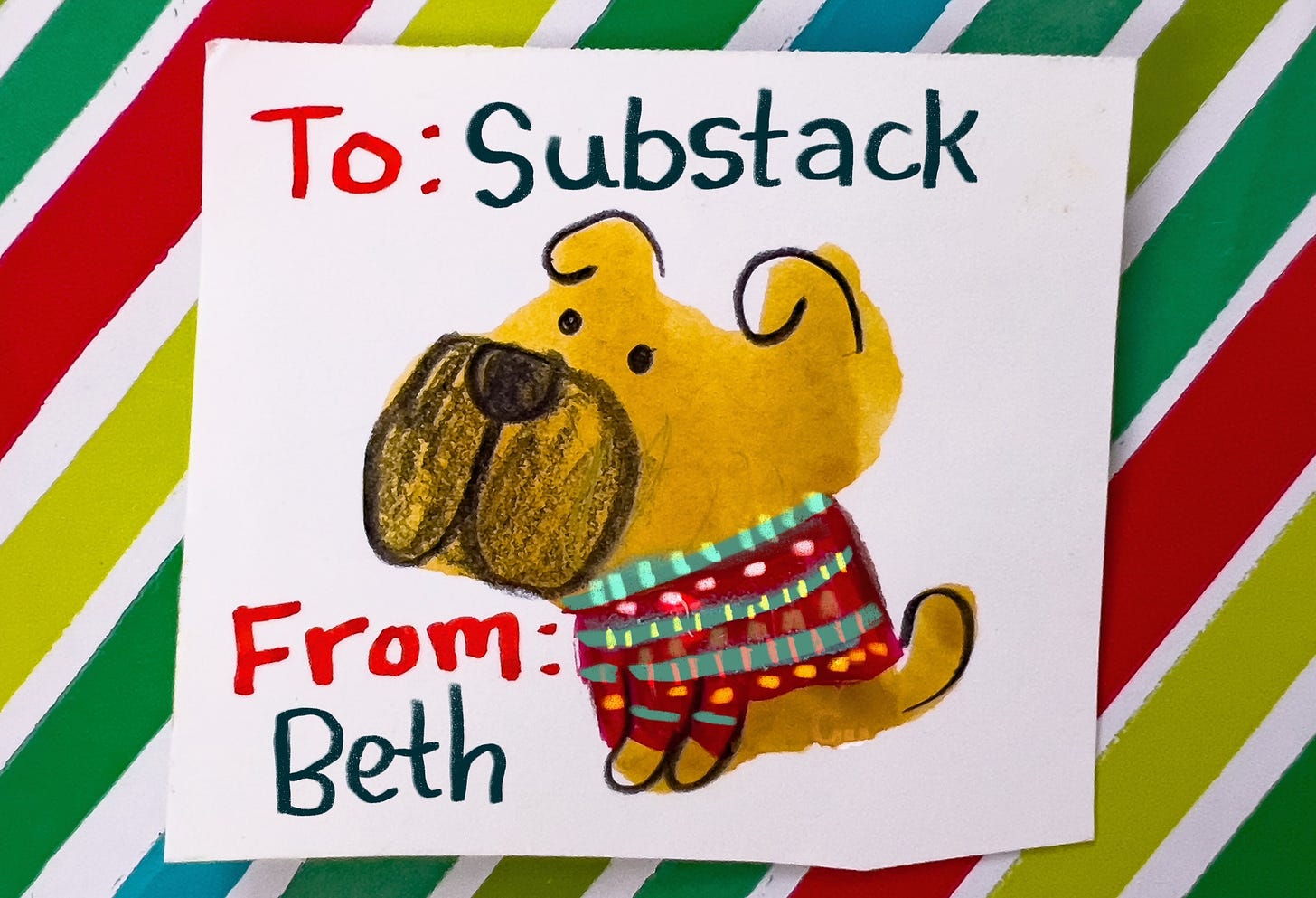 gift tag with cute puppy wearing a holiday sweater illustrated by Beth Spencer