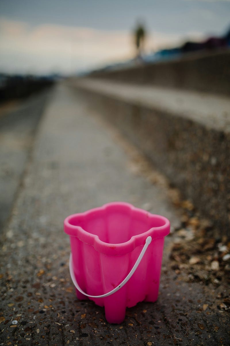An empty pink bucket