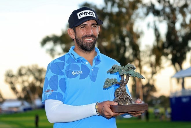 Matthieu Pavon of France poses with the trophy after winning the Farmers Insurance Open at Torrey Pines South Course on January 27, 2024 in La Jolla, California. (Photo by Sean M. Haffey/Getty Images)