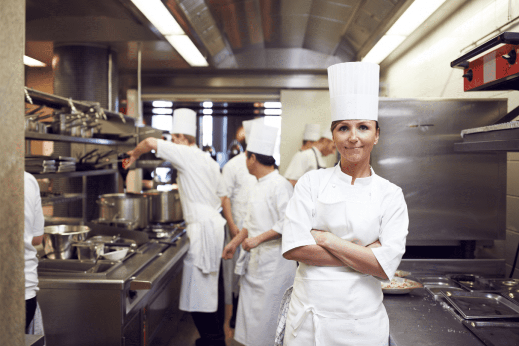 young woman chef confident and running her kitchen smoothly