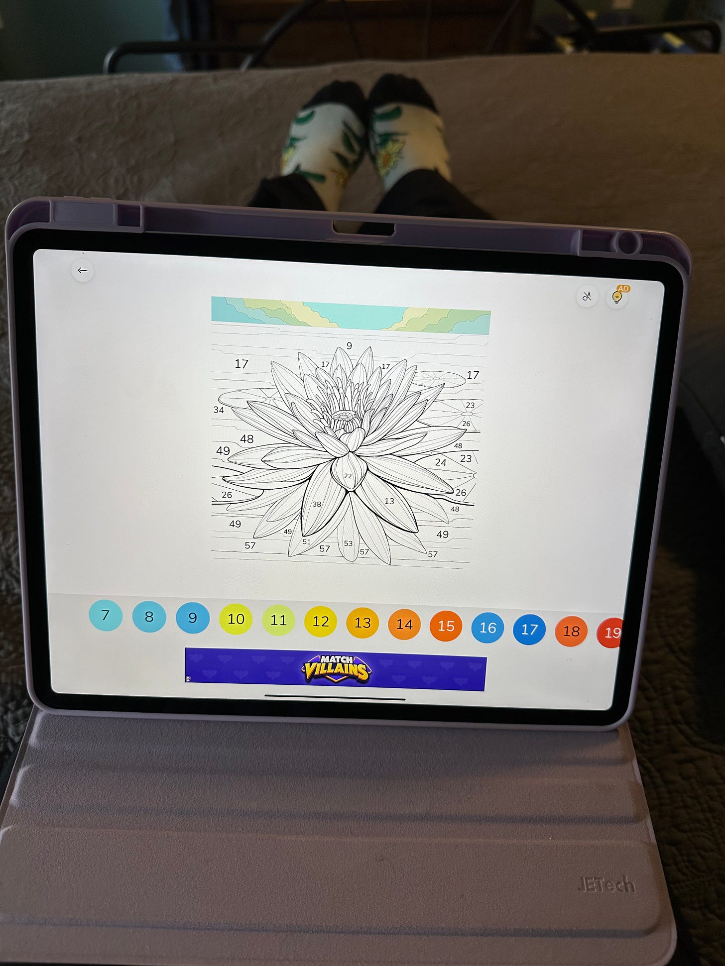 ipad on lap with lotus on screen