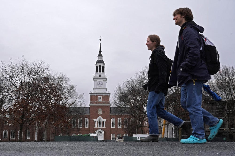 Students cross the campus of Dartmouth College