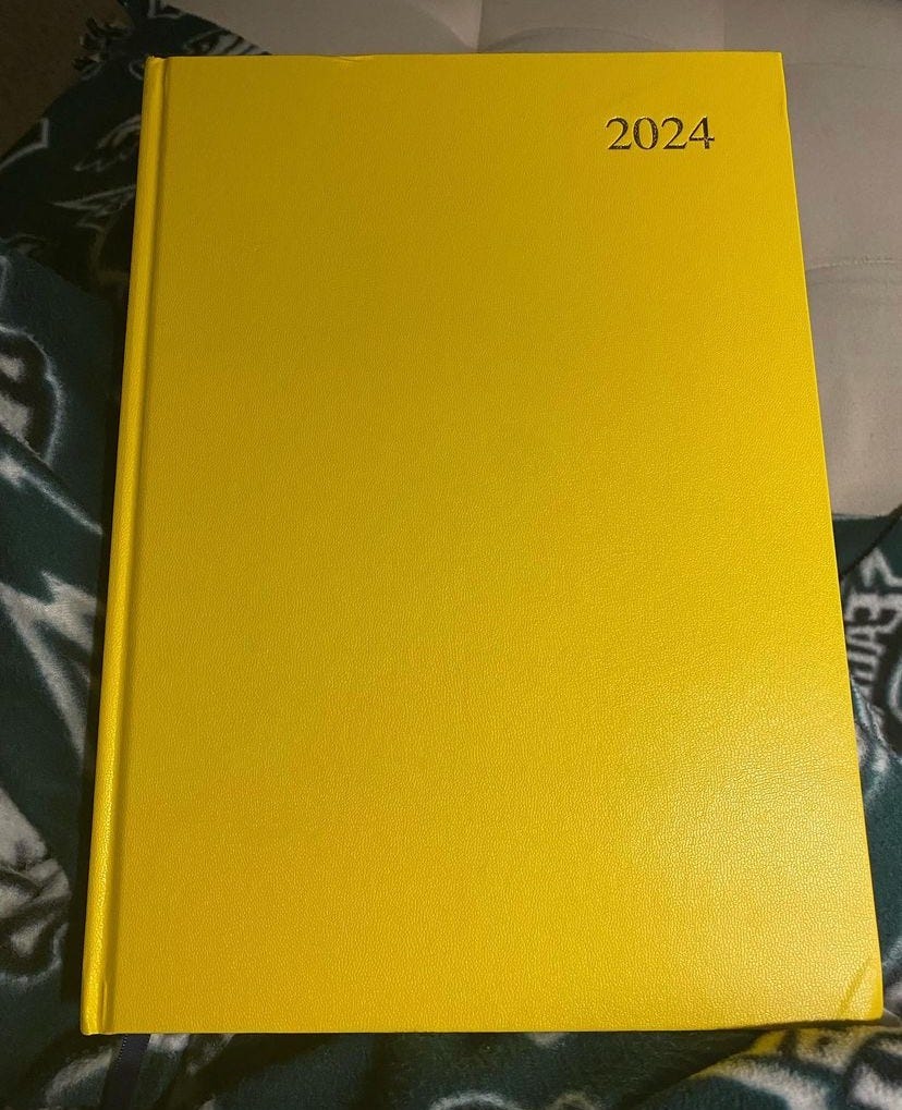 large yellow journal with 2024 on the cover