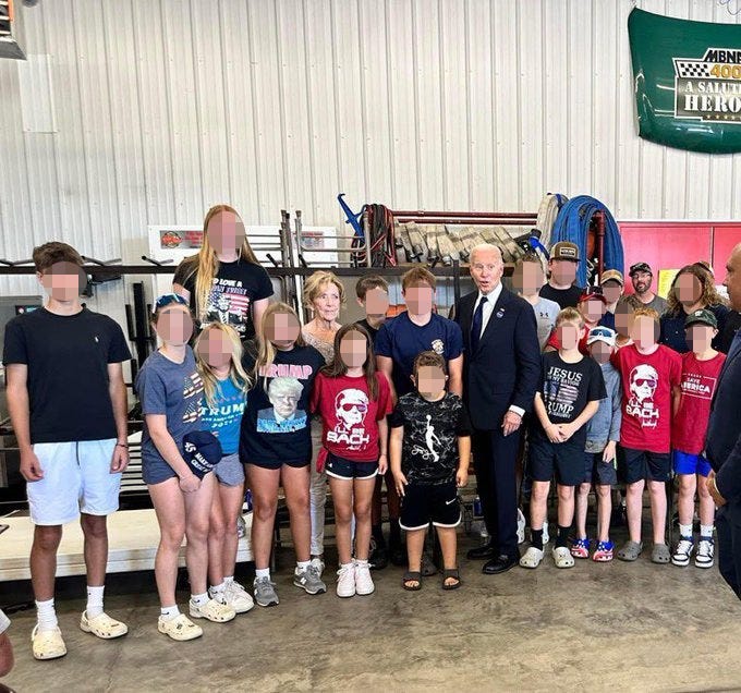 President Joe Bden posed for a picture with several kids wearing Donald Trump gear during his visit to Shanksville, Pa. on Sept. 11, 2024.