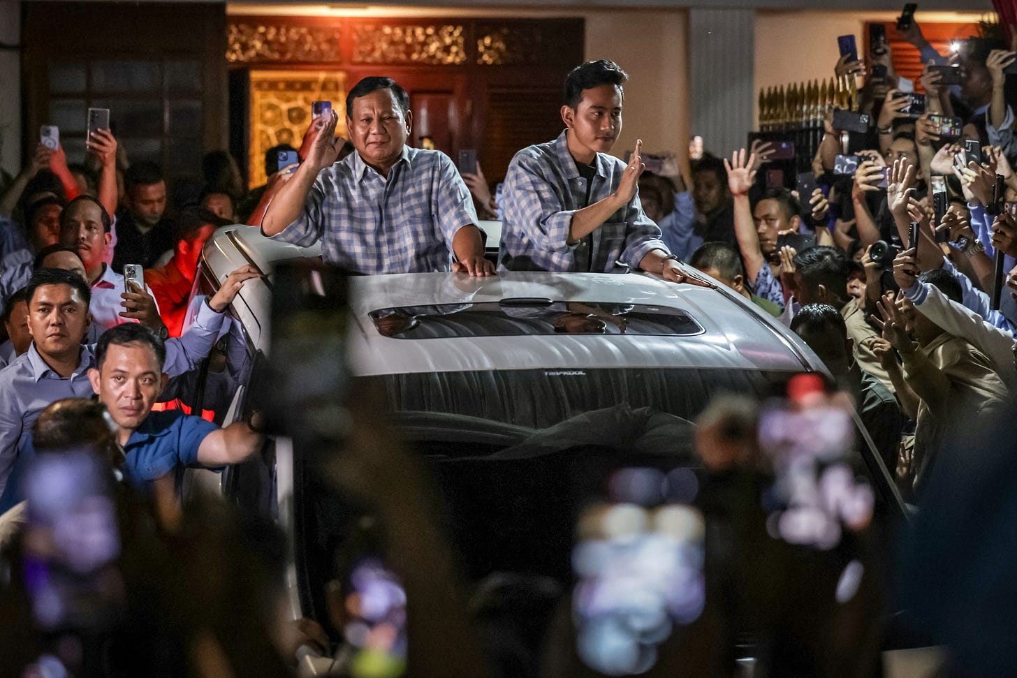 President-elect Prabowo Subianto and Vice President-elect Gibran Rakabuming Raka. (Photo by Yasuyoshi Chiba / AFP via Getty Images.)