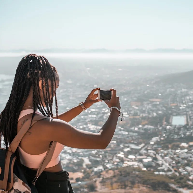 Young woman making the photo of Cape Town, South Africa.