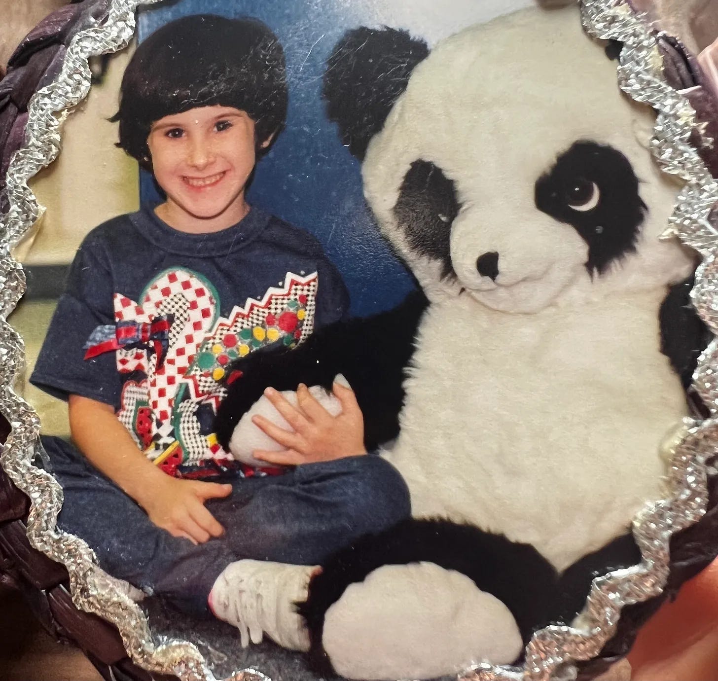 Young Lyric in denim outfit, with a huge panda bear stuffed toy, that is bigger than the scrony Lyric (who didn’t weigh more than 45-50 lbs).