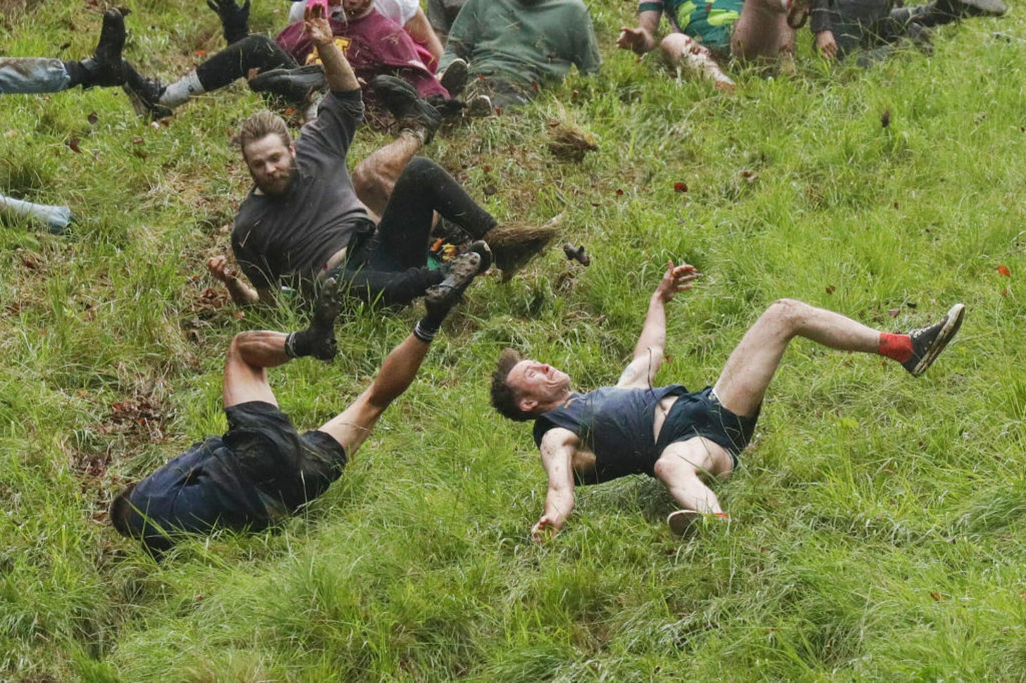 Chaotic photos from the UK's annual cheese rolling contest | Mashable