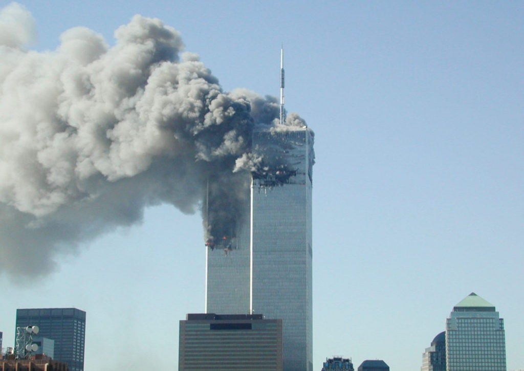 394261 06: Smoke pours from the World Trade Center after being hit by two planes September 11, 2001 in New York City. (Photo by Fabina Sbina/ Hugh Zareasky/Getty Images)