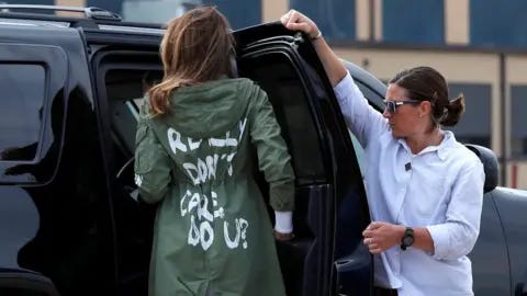 Reuters US First Lady Melania Trump walks from her to airplane to her motorcade wearing a Zara design jacket with the phrase (slogan) "I Really Don"t Care. Do U?" on the back