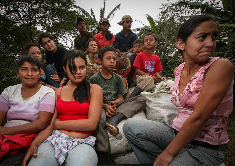 Coffee pickers on their way to the mill on the back of a truck at the Flor del Pino coop, a Fairtrade-certified producer organisation based in Ocotepeque, Honduras. Under Informed Consent rules, everyone on this truck would have to give their consent for this photo to be taken or used, and if the parents of the minors weren't present they'd have to be found to give their consent. Seeking the informed consent in this case could take so long, it wouldn't be worth the trouble. Photo by Sean Hawkey. Coffee pickers on their way to the mill on the back of a truck at the Flor del Pino coop, a Fairtrade-certified producer organisation based in Ocotepeque, Honduras. Under Informed Consent rules, everyone on this truck would have to give their consent for this photo to be taken or used, and if the parents of the minors weren't present they'd have to be found to give their consent. Seeking the informed consent in this case could take so long, it wouldn't be worth the trouble. Photo by Sean Hawkey.
