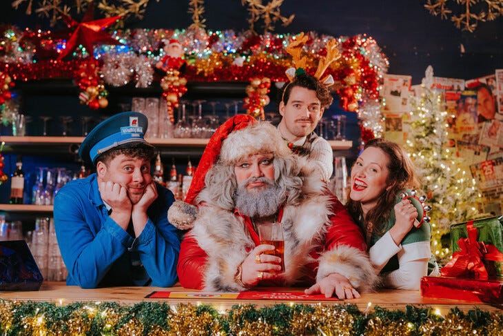 A slightly sozzled looking Santa at the bar with friends