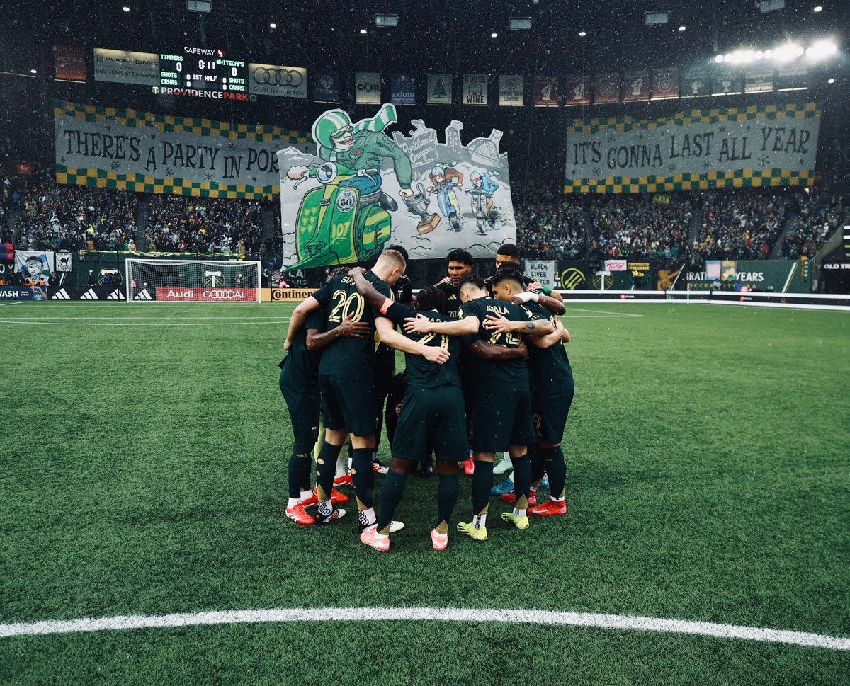 Timber team huddle with tifo