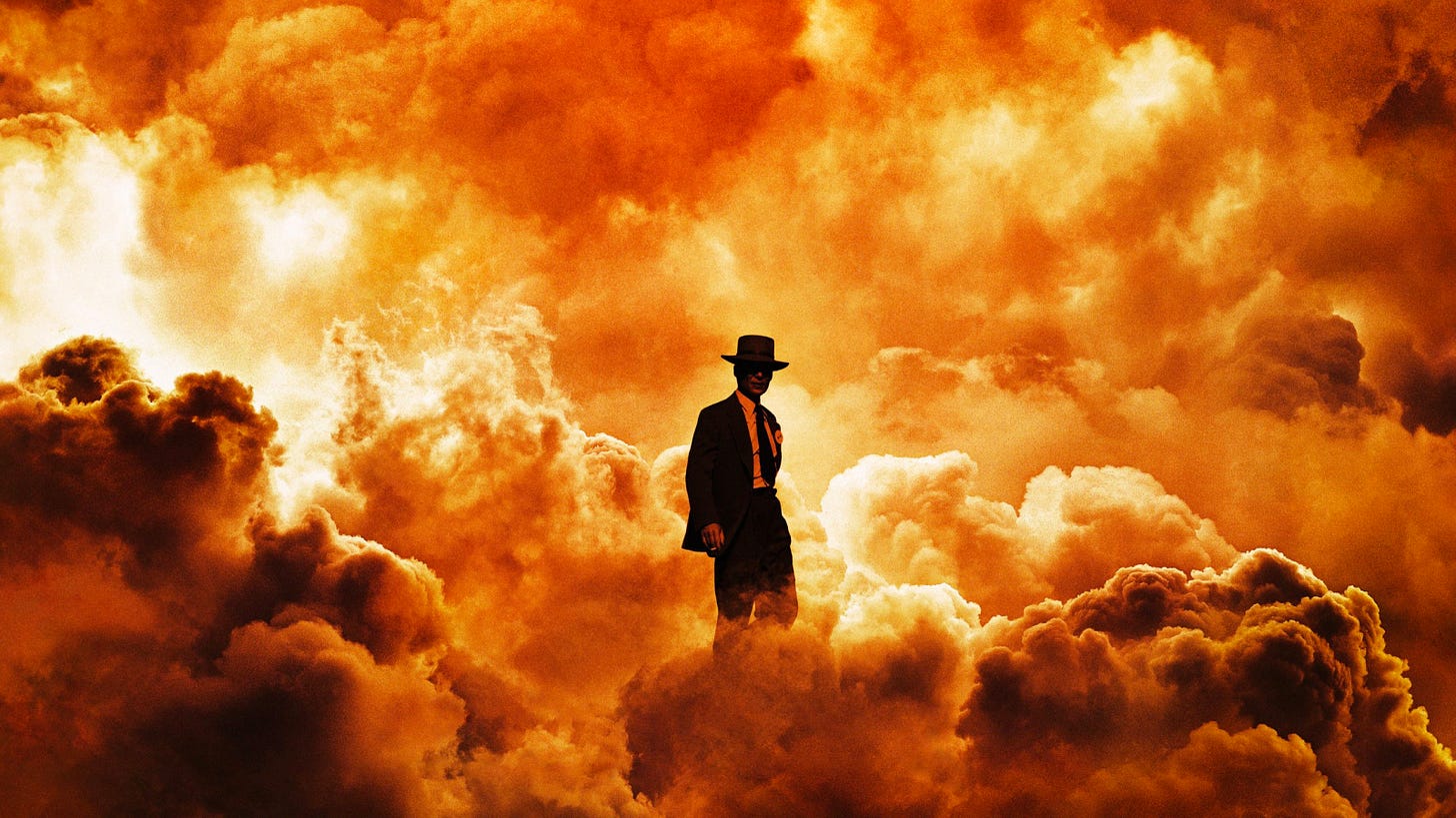 image of cillian murphy as oppenheimer in an orange cloud of smoke