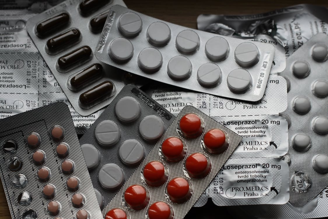 Free Close-up of various pills in blister packs showcasing medical and healthcare themes. Stock Photo