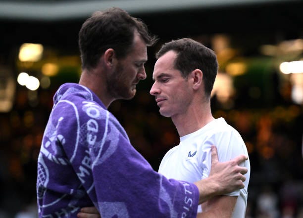 Jamie Murray and Andy Murray of Great Britain appear emotional as they embrace following the Gentlemen’s Doubles first round match against Rinky...