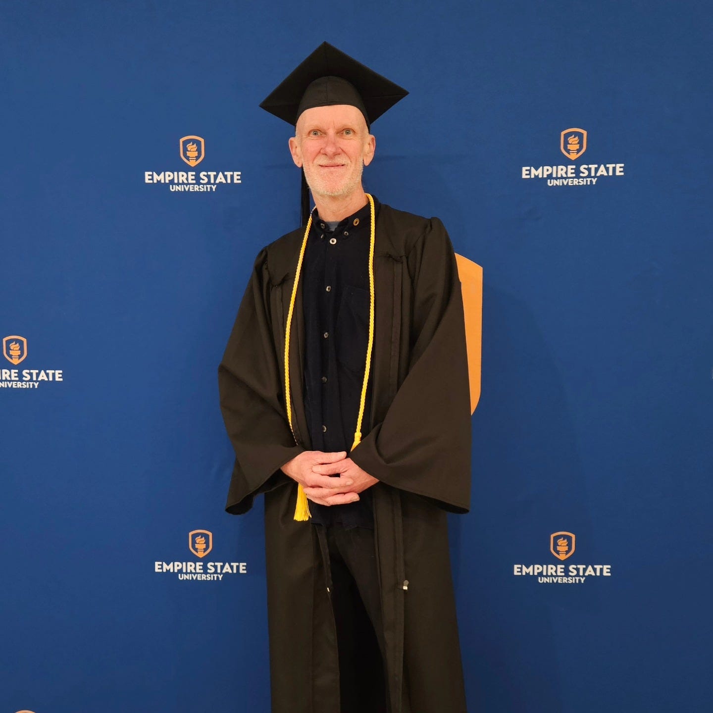 May be an image of 1 person and text that says "EMPIRE EMPIRESTATE STATE UNIVERSITY EMPIRE EMPIRESTATE STATE UNIVERSITY 9 RE RE STATE HIVERSITY EMPIRE EMPIRESTATE UNIVERSITYATE UNIVERSITY STATE EMPIRE EMPIRESTATE STATE UNIVERSITY"