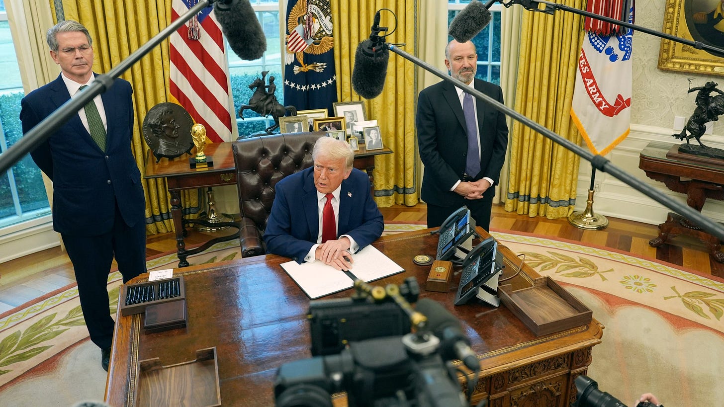 President Donald Trump speaks as Treasury Secretary Scott Bessent, left, and Commerce Secretary nominee Howard Lutnick listen as Trump prepares to sign an executive order in the Oval Office of the White House, Monday, Feb. 3, 2025, in Washington. (AP Photo/Evan Vucci)