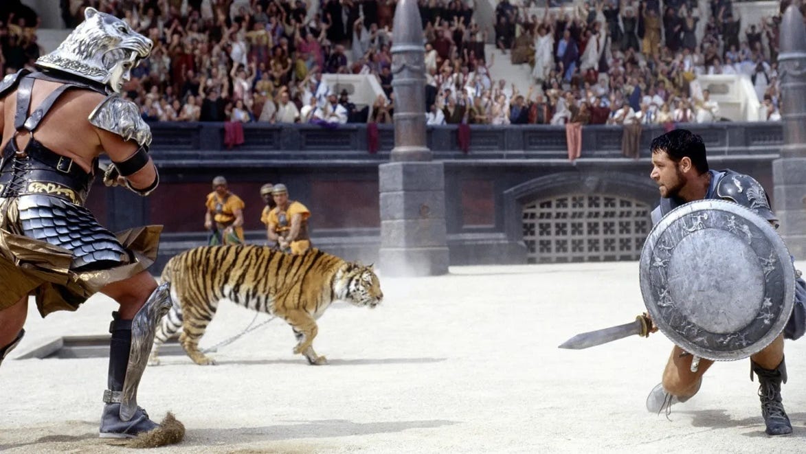 A tiger in a arena with a sword

Description automatically generated